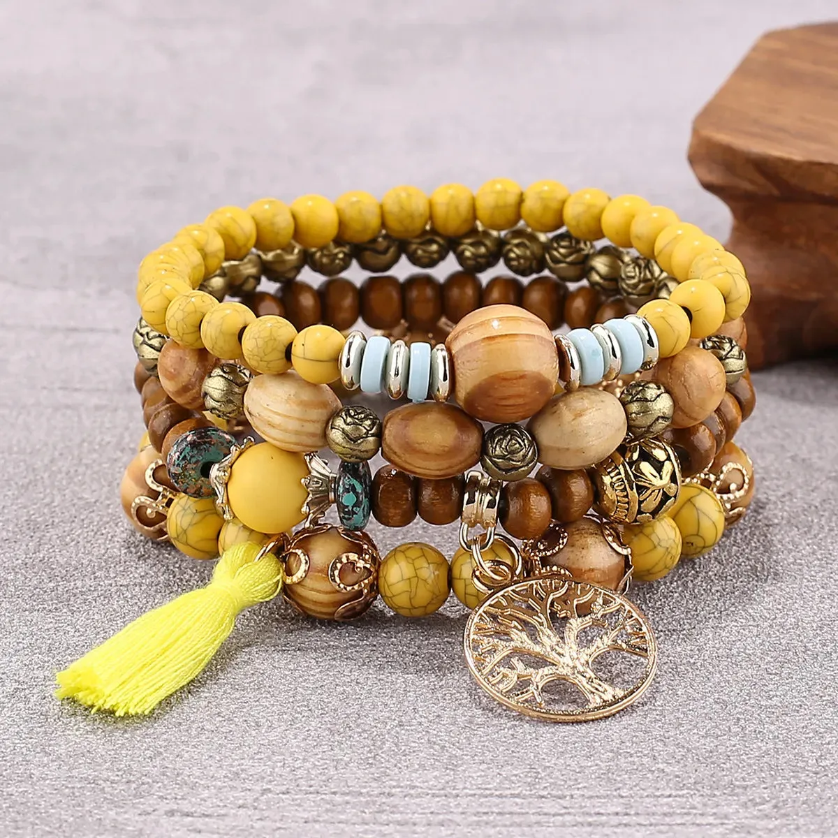 Add a touch of style with our Boho Bracelet Set: Handmade Wood Beads, Tree of Life Charms, Perfect for Bohemian Chic!