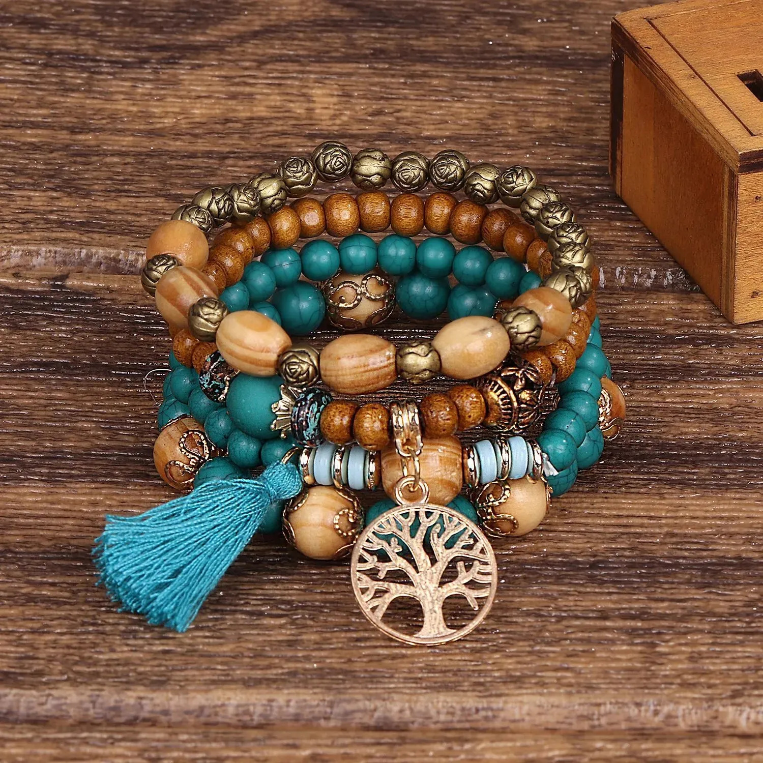 Add a touch of style with our Boho Bracelet Set: Handmade Wood Beads, Tree of Life Charms, Perfect for Bohemian Chic!